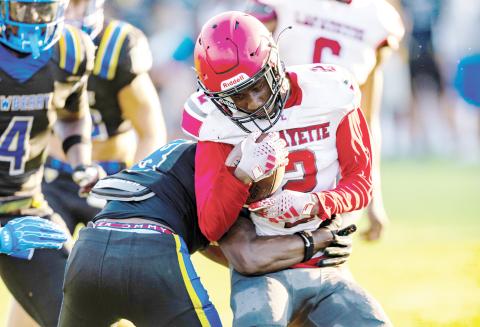 Lafayette receiver Jordan Murphy takes a hit from a Newberry defender after a catch in their Preseason Classic on Aug. 15. (JACK HOWDESHELL/Lake City Reporter)