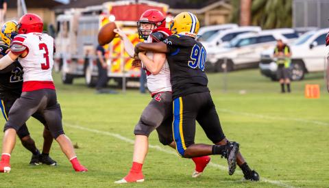 Lafayette quarterback Tucker Higginbotham is sacked by Newberry defensive lineman Dyllan Strappy during Thursday's Preseason Classic. (JACK HOWDESHELL/Special to the Reporter)