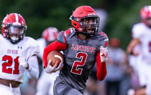 Lafayette receiver Jordan Murphy races to the end zone for a touchdown against Dixie County on Friday. (JACK HOWDESHELL/Lake City Reporter)