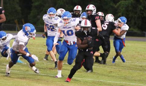 Fort White running back Keimarion Neal races up the field against Taylor County last Friday. (MORGAN MCMULLEN/Lake City Reporter)