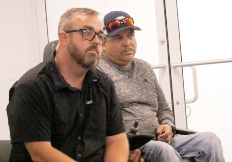 Dustin Busscher (left) and Abel Caballero listen as the Board of Adjustments discusses whether to grant a special exception for Caballero to operate a welding shop on his property in western Columbia County. The board did grant the exception. (JAMIE WACHTER/Lake City Reporter)