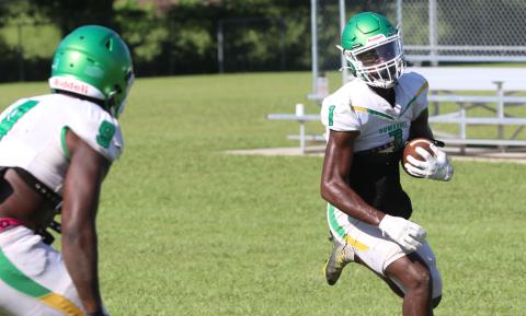 Suwannee receiver MJ Rossin turns up the field after catching a pass during Saturday’s practice. (JAMIE WACHTER/Lake City Reporter)