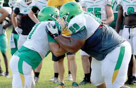 Suwannee offensive lineman Brody Bean and defensive lineman Will Brown perform a run-blocking drill during practice on Aug. 3. (JAMIE WACHTER/Lake City Reporter)