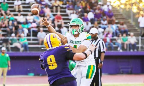 Suwannee quarterback Thomas Sikes throws a pass as Columbia defensive end Kyten Davis applies pressure on Friday. (BRENT KUYKENDALL/Lake City Reporter)