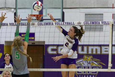 Columbia hitter Sinei Wood fires a shot over the arms of Suwannee's Brooke Fernald on Tuesday night. (BRENT KUYLENDALL/Lake City Reporter)