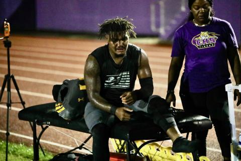 Columbia linebacker Chris Jordan sits on the trainer's table after suffering a high-ankle sprain during Friday's game against Madison County. (BRENT KUYKENDALL/Lake City Reporter)