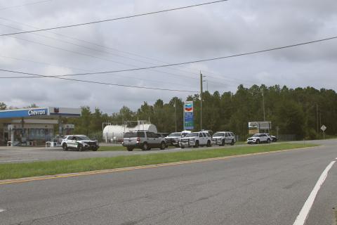 Columbia County Sheriff’s Office deputies set up operations near the intersection of Interstate 10 and U.S. Highway 441 on Monday afternoon while searching for a fugitive. (TONY BRITT/Lake City Reporter)