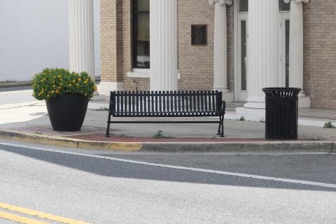 A city bench sits along N. Marion Avenue on Wednesday. Four similar benches were stolen Monday night from the city’s easements along Marion Avenue. (TONY BRITT/Lake City Reporter)