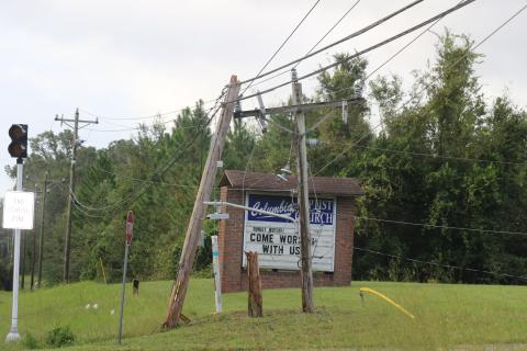 A splintered power pole sits along State Road 47 in front of Columbia City Baptist Church after Hurricane Helene passed through early Friday morning. (JAMIE WACHTER/Lake City Reporter)