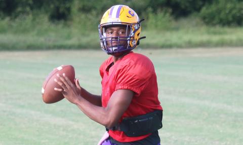 Columbia quarterback Xavier Collins drops back to pass during Tuesday’s practice. (JORDAN KROEGER/Lake City Reporter)