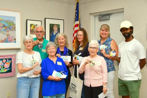 The Live Oak Artists Guild honored the winners in the 26th annual Autumn Artfest during a reception Sept. 7 at the Suwannee River Regional Library branch in Live Oak. The winners in the fine arts exhibition included, front row, Judith Adams (front row, from left), Glinda Pennock, Anda Chance; back row, Rob Wolfe, Christie Stanton, Renee Shiska and Sharon Hester. Jason Holland (back row, right) was the subject of Connor Billups’ honorable mention drawing. (ROB WOLFE/Special to the Reporter)