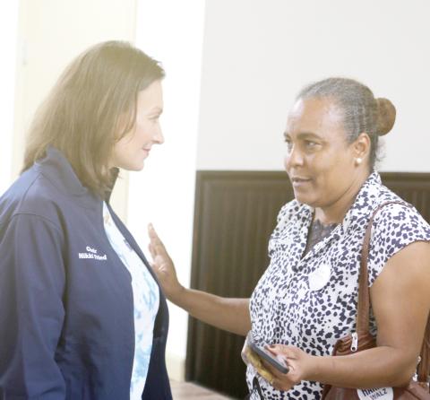 Nikki Fried, the Florida Democratic Party chair, talks with Nice Wells, of Gainesville, after a rally for the Kamala Harris presidential campaign at the Columbia County Woman’s Club on Sunday. (TONY BRITT/Lake City Reporter)