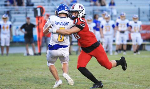 Fort White linebacker Teagin Beil makes a tackle against Fernandina Beach last Friday. (PAUL BUCHANAN/Lake City Reporter)