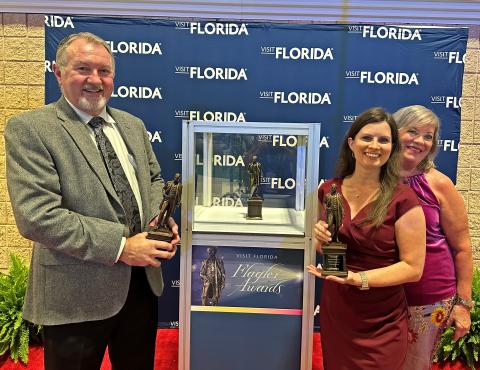 Suwannee County Tourist Development Council Director Jimmy Norris and Marketing Coordinator Charissa Setzer hold the Flagler Awards that the county received for their tourism marketing campaign, ‘Soul of Suwannee.’ Pictured with Norris and Setzer is Danah Heye with Madden Media, an advertising agency that works with Suwannee TDC. (COURTESY)