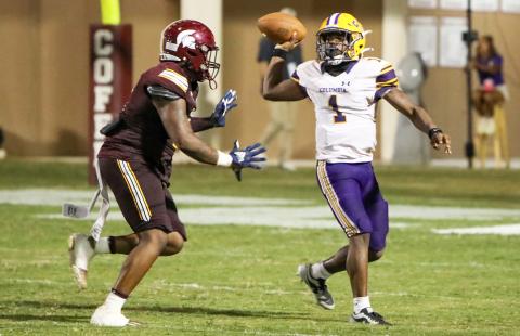 Columbia quarterback Zamarion Jones throws a pass under pressure during last Friday’s game against Coffee. (BRENT KUYKENDALL/Lake City Reporter)