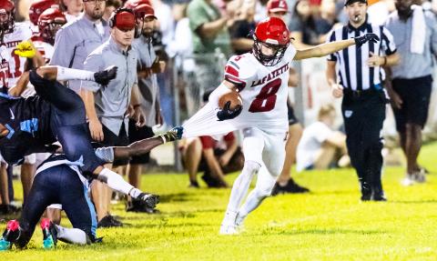 Lafayette receiver Parker Hill tries to escape a tackle from a Zarephath Academy defender on Friday. (JACK HOWDESHELL/Lake City Reporter)