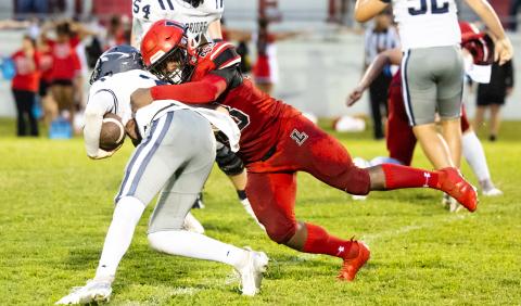 Lafayette’s Zamarion Hawkins wraps up a Brookwood runner last Friday night. (JACK HOWDESHELL/Lake City Reporter)
