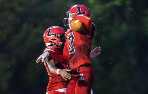 Lafayette receiver Jordan Murphy (2) celebrates with quarterback Tywan Williamson (9) after they connected for a touchdown against Brookwood on Friday. (JACK HOWDESHELL/Lake City Reporter)