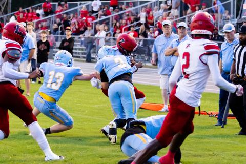 Lafayette quarterback Tywan Williamson is hit hard by Chiefland safety Jolan Doty on Friday. (JACK HOWDSHELL/Lake City Reporter)
