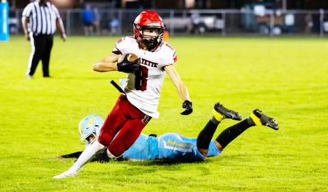 Lafayette receiver Parker Hill evades a Chiefland defender during last Friday’s game. (JACK HOWDESHELL/Lake City Reporter)