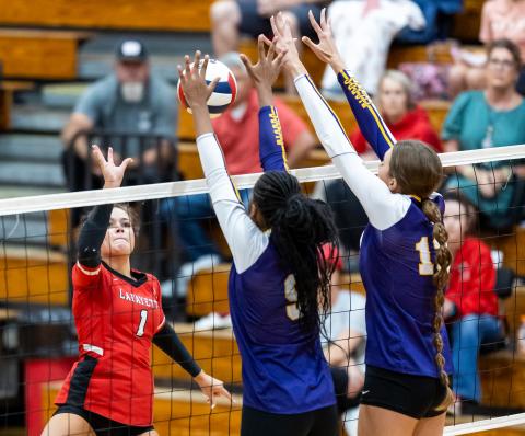 Lafayette hitter Brooke Lamb sends a shot over the net against Columbia on Tuesday. (JACK HOWDESHELL/Lake City Reporter)