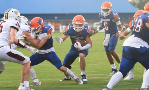Branford running back Trevor Maddox hits the hole against Oak Hall on Aug. 23. (PAUL BUCHANAN/Lake City Reporter)