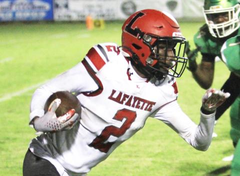 Lafayette receiver Jordan Murphy runs up the field after a catch against Suwannee last Friday. (PAUL BUCHANAN/Special to the Reporter)