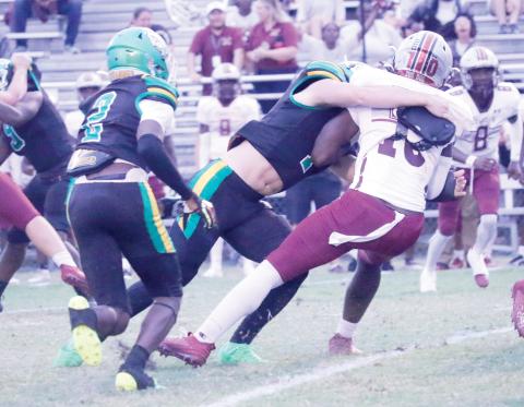 Suwannee linebacker Jace Moran tackles Madison County’s De’Andre Arnold last Friday night. (JAMIE WACHTER/Lake City Reporter)