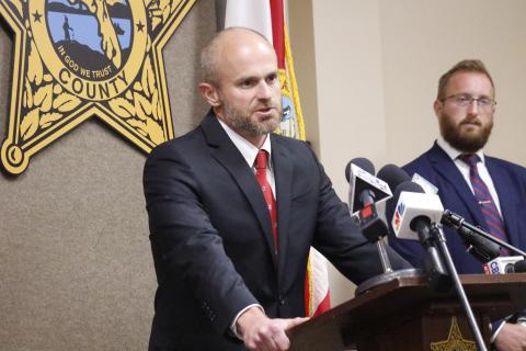 John Durrett, state attorney for the Third Judicial Circuit, said Wednesday that social media threats are not a joke, warning anyone that makes a threat will face consequences for their actions. Assistant State Attorney Chase Larsen looks on. (JAMIE WACHTER/Lake City Reporter)