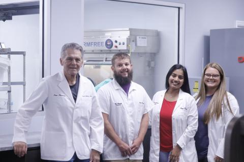 Baya Pharmacy East has added a sterile compounding lab in which it will start producing its own weight-loss drugs for customers. Pictured in front of one of the sterile machines in one of the sterile rooms at the pharmacy are Baya Pharmacy owner Carl Allison (from left), pharmacist AJ Ward, Director of Clinical Sciences Shivani Mehta and pharmacist Danae Ray. Mehta and Ward are certified to operate the sterile compounding lab and hazardous compounding lab. (JAMIE WACHTER/Lake City Reporter)