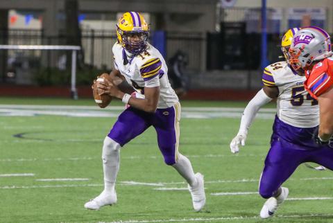 Columbia quarterback Xavier Collins rolls out to pass against Bolles last Friday. (BRENT KUYKENDALL/Lake City Reporter)