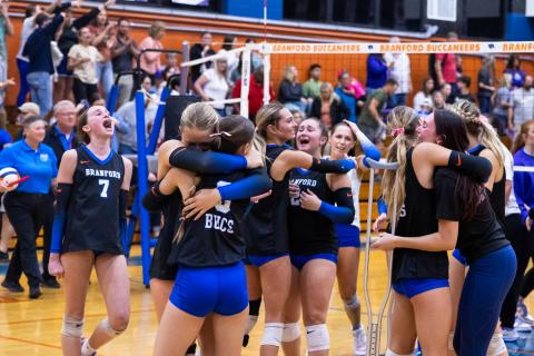 Branford celebrates after winning the fifth set to beat Union County in the Region 3-R championship on Tuesday. (JACK HOWDESHELL/Lake City Reporter)