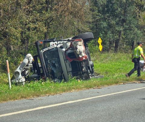 Three linemen from North Carolina were injured when their bucket truck overturned as part of a four-vehicle crash northwest of Jasper on Wednesday afternoon. A Jasper man was killed in the crash. (COURTESY)