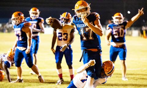 Branford quarterback Trent Land powers through a Jefferson County defender for a touchdown Friday. (JACK HOWDESHELL/Lake City Reporter)