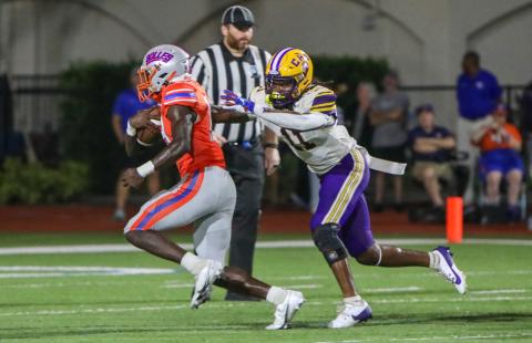 Columbia safety Da’jon Brown tries to wrap up Bolles running back Tyrone Neal on Friday night. (BRENT KUYKENDALL/Lake City Reporter)