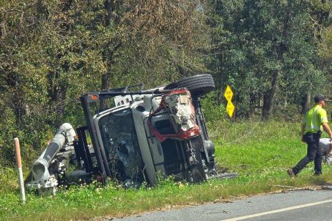 Three linemen from North Carolina were injured when their bucket truck overturned as part of a four-vehicle crash northwest of Jasper on Wednesday afternoon. A Jasper man was killed in the crash. (COURTESY)