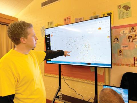 Andrew Miner, the president of the Cocoa Beach Stake of the Church of Jesus Christ of Latter-day Saints, looks at a map of the cleanup work needed in North Florida following Hurricane Helene. (JAMIE WACHTER/Lake City Reporter)