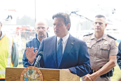 Gov. Ron DeSantis gives an update on Hurricane Milton from the Florida Gateway Fairgrounds on Wednesday afternoon. DeSantis said the state government is undertaking a “massive” response to Milton’s arrival. (MORGAN MCMULLEN/Lake City Reporter)