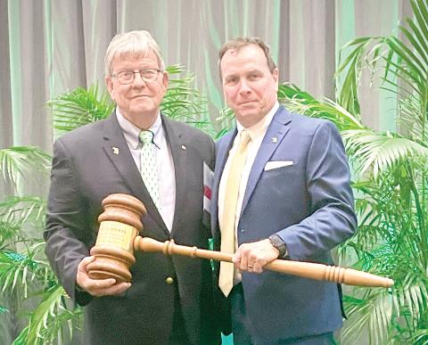 Avery C. Roberts (right) accepts gavel from outgoing president Jimmy Bielling at the Florida Forestry Association 2024 annual meeting. (COURTESY)