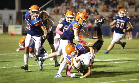 Branford’s Dawson Cannon (5) makes a tackle against Trenton on Oct. 4. (PAUL BUCHANAN/Lake City Reporter)