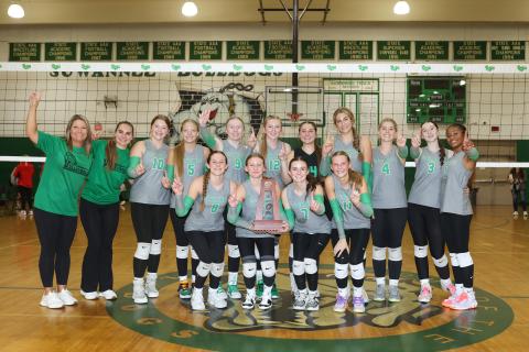 Suwannee's volleyball team poses with the District 2-4A championship trophy after rallying to beat Wakulla on Thursday night. (PAUL BUCHANAN/Lake City Reporter)