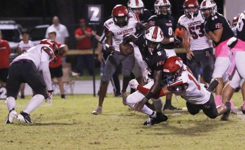  Fort White quarterback Jayden Jackson is tackled by Lafayette’s Joseph Smith on Oct. 4. (JAMIE WACHTER/Lake City Reporter)