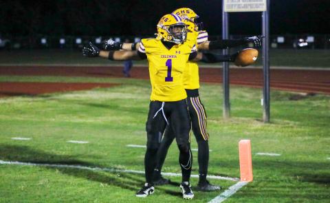 Columbia receiver Zamarion Jones (1) celebrates with receiver Bynton Edge in the end zone after scoring on a 4-yard touchdown run on 4th-and-goal against Ridgeview on Friday. (BRENT KUYKENDALL/Lake City Reporter)