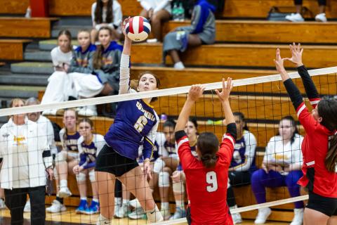 Columbia hitter Sinei Wood (6) fires a shot toward Lafayette middle blocker Sophia Kendrick (9) and hitter Rylee Skillman (right) on Sept. 24. (JACK HOWDESHELL/Lake City Reporter)