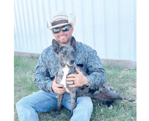 Jared Lee, a Live Oak cowboy, is pictured with Rainbow, his world champion cowdog. Rainbow won her third straight world title this past weekend at the Hangin’ Tree Cowdog Association world championships in Texas. (COURTESY)