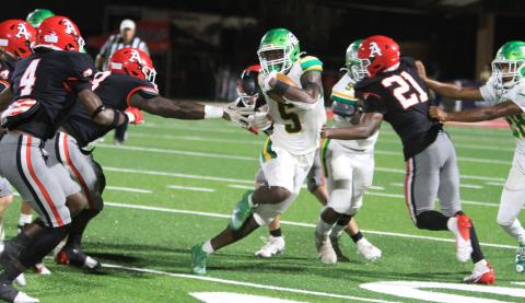 Suwannee receiver MJ Rossin tries to avoid Appling County tacklers as he runs up the field on Sept. 20. (PAUL BUCHANAN/Lake City Reporter)