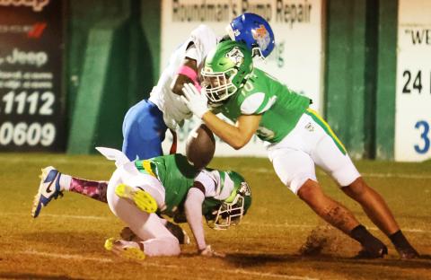 Suwannee safety Koy Frier forces a fumble with a big hit on Taylor County receiver James Mingo on Friday. (PAUL BUCHANAN/Lake City Reporter)