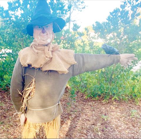 An entry into last year’s Scarecrow Festival is pictured with a crow companion. This year’s event has been delayed. (COURTESY)