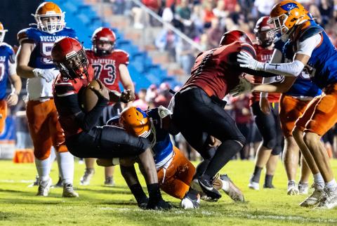 Lafayette quarterback Tywan Williamson fights for extra yardage against Branford on Monday. (JACK HOWDESHELL/Lake City Reporter)