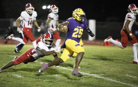 Columbia running back Jerome Horne races past a diving North Miami Beach defender on his way to the end zone for one of his three touchdowns in Friday’s 42-0 win. (BRENT KUYKENDALL/Lake City Reporter)